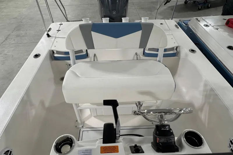 Slide: The Image of 2026 Robalo 206 Cayman boat interior with steering wheel and seating. - 4