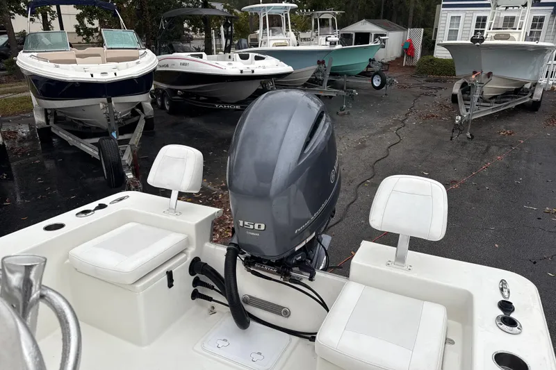 Slide: The Image of 2017 Bay Rider 2260 FS Skiff with Yamaha 150 outboard motor, parked among other boats. - 5