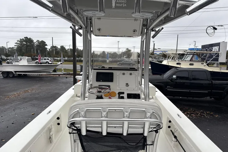 Slide: The Image of 2017 Bay Rider 2260 FS Skiff boat interior with console and seating, parked outdoors. - 6