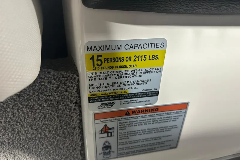 Slide: The Image of Capacity label on 2016 Malibu Wakesetter 23 LSV, maximum 15 persons or 2115 lbs. - 18