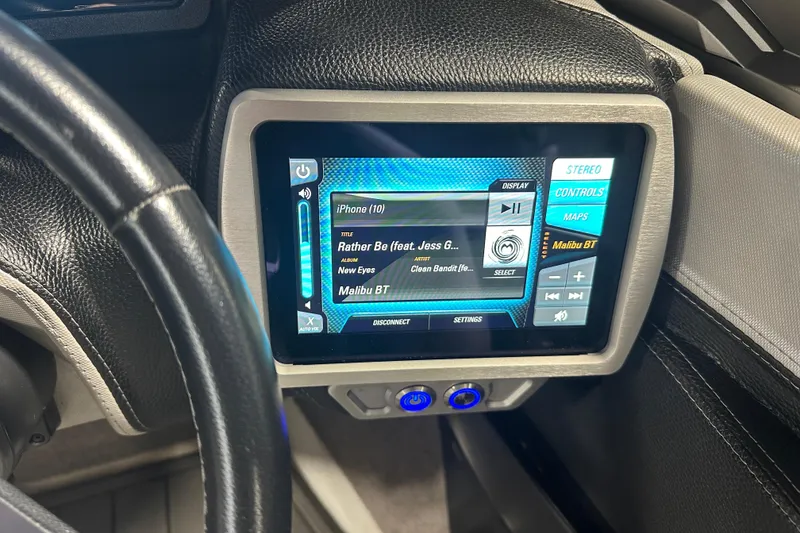 Slide: The Image of Touchscreen display in 2016 Malibu Wakesetter 23 LSV showing music controls and settings. - 20