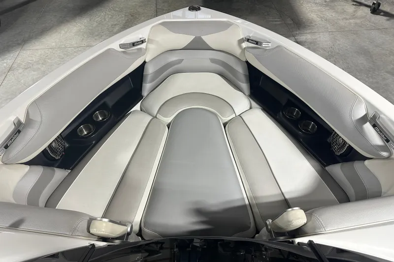 Slide: The Image of 2016 Malibu Wakesetter 23 LSV boat interior with gray and white seating. - 21