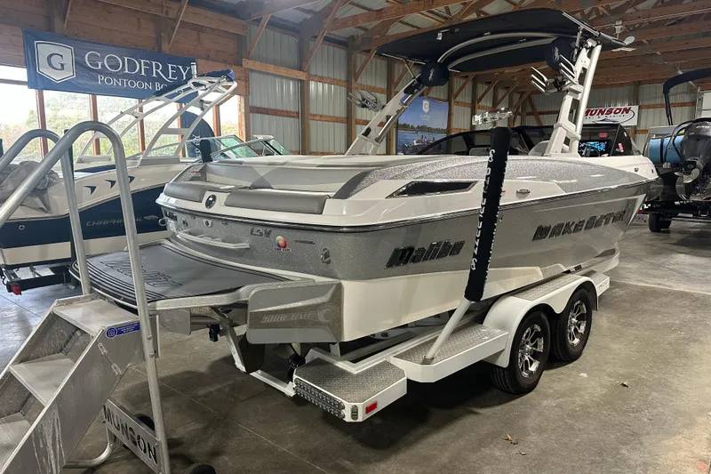 Slide: The Image of 2016 Malibu Wakesetter 23 LSV boat on trailer in showroom. - 4