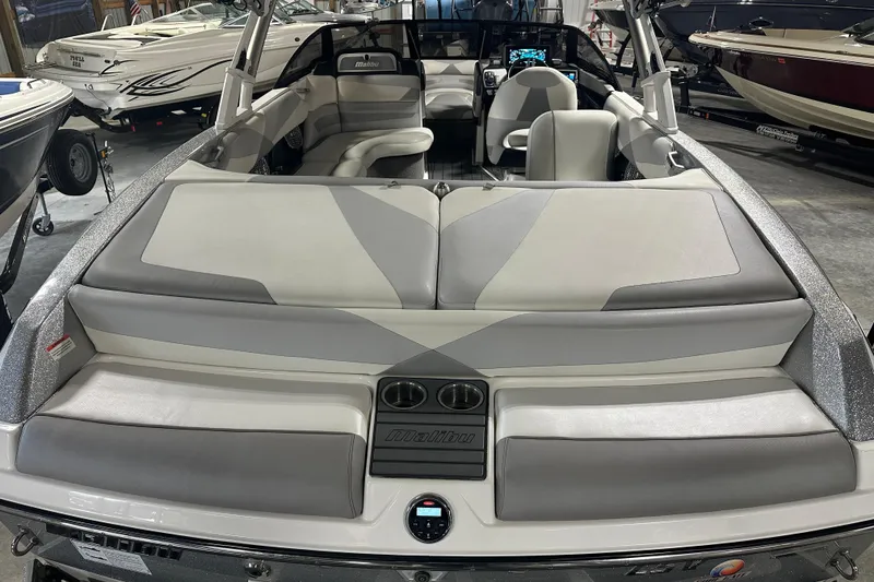 Slide: The Image of 2016 Malibu Wakesetter 23 LSV boat interior with gray seating and dashboard. - 8