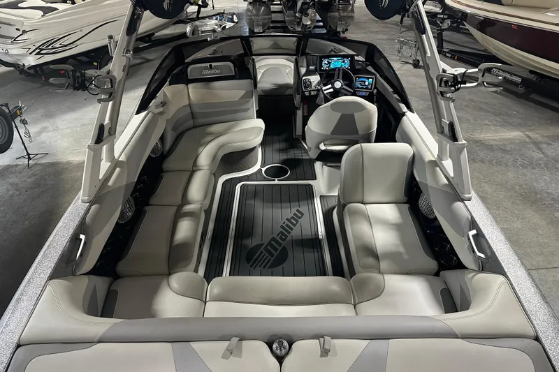 Slide: The Image of 2016 Malibu Wakesetter 23 LSV interior with sleek seating and modern dashboard. - 9