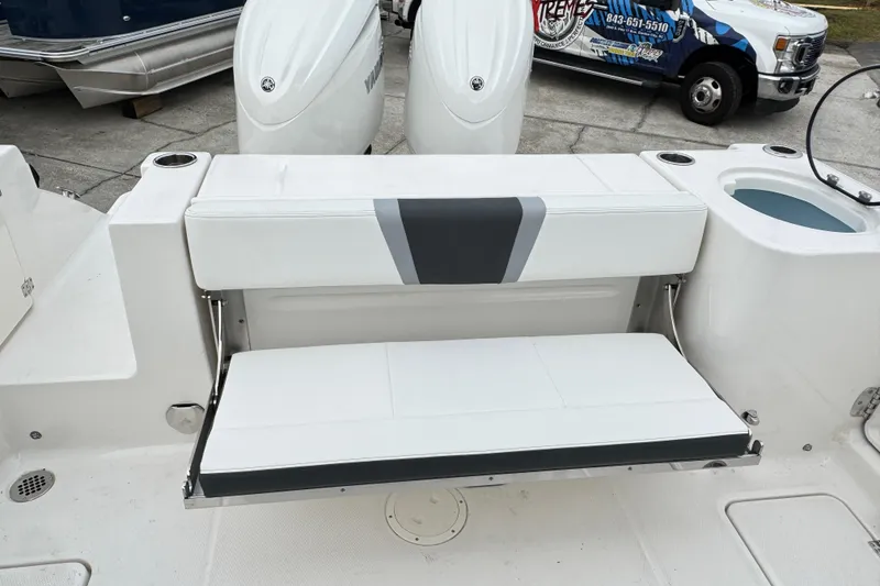 Slide: The Image of 2026 Robalo R250 Center Console boat with foldable rear seating and Yamaha engines. - 10