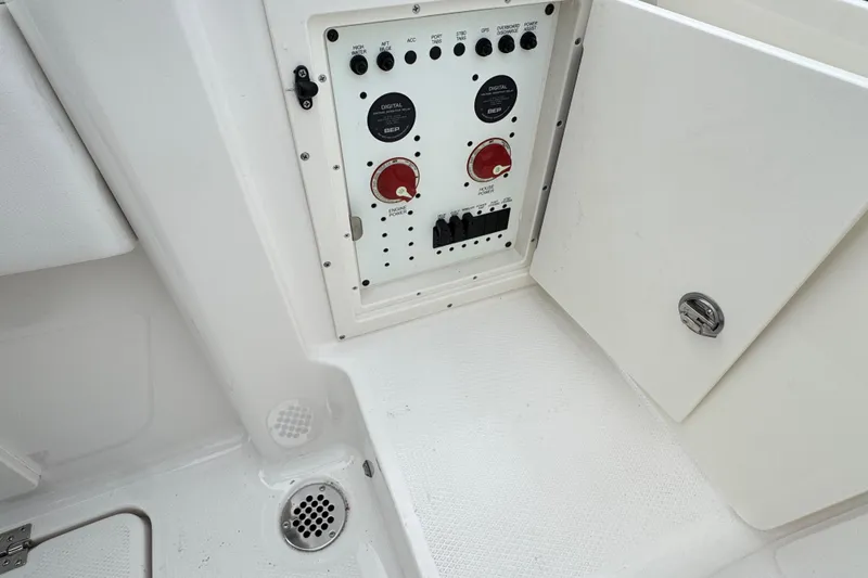 Slide: The Image of Control panel of 2026 Robalo R250 Center Console boat, featuring switches and dials. - 22