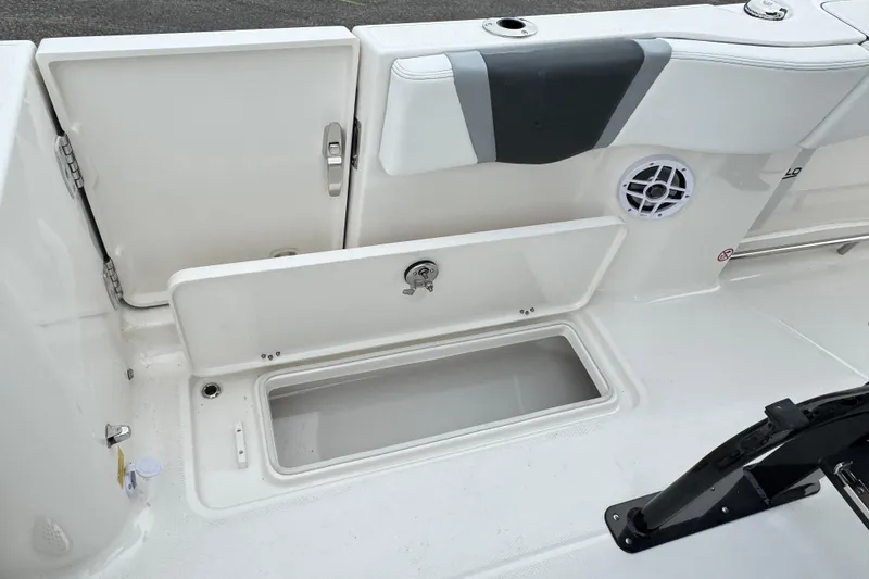 Slide: The Image of 2026 Robalo R250 Center Console boat storage compartment and seating area. - 29
