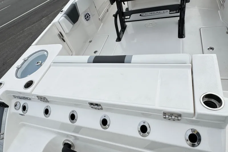 Slide: The Image of 2026 Robalo R250 Center Console boat interior with seating and storage compartments. - 32