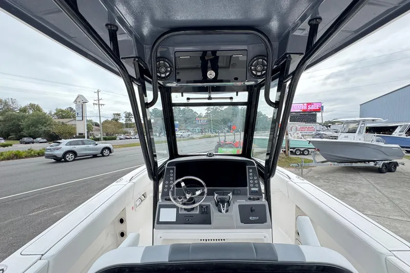 Slide: The Image of 2026 Robalo R250 Center Console boat interior with modern dashboard and steering wheel. - 33