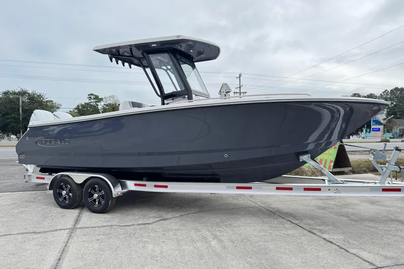 Slide: The Image of 2026 Robalo R250 Center Console boat on trailer, sleek design, gray hull, outdoor setting. - 37