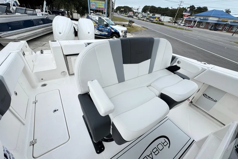 Slide: The Image of 2026 Robalo R250 Center Console boat interior with white and gray seating. - 4