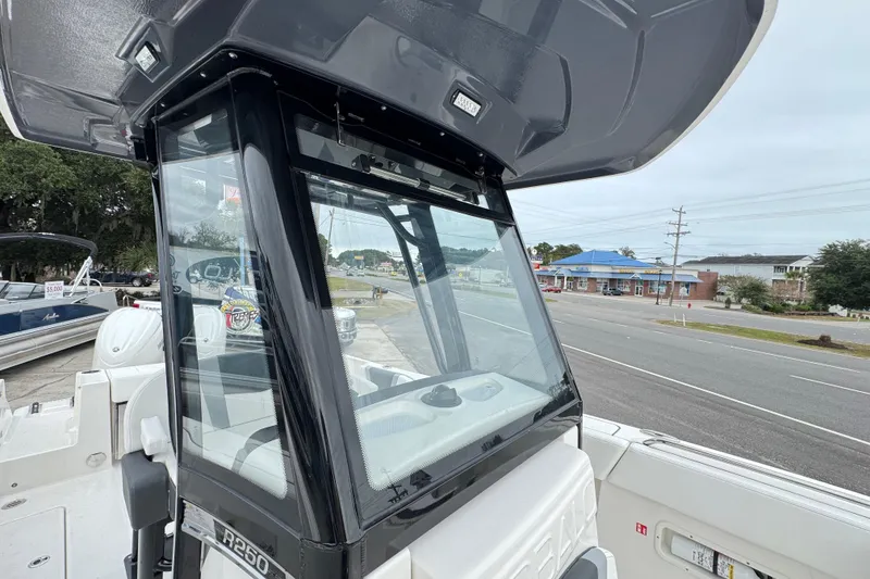 Slide: The Image of 2026 Robalo R250 Center Console boat with sleek design and modern features. - 7