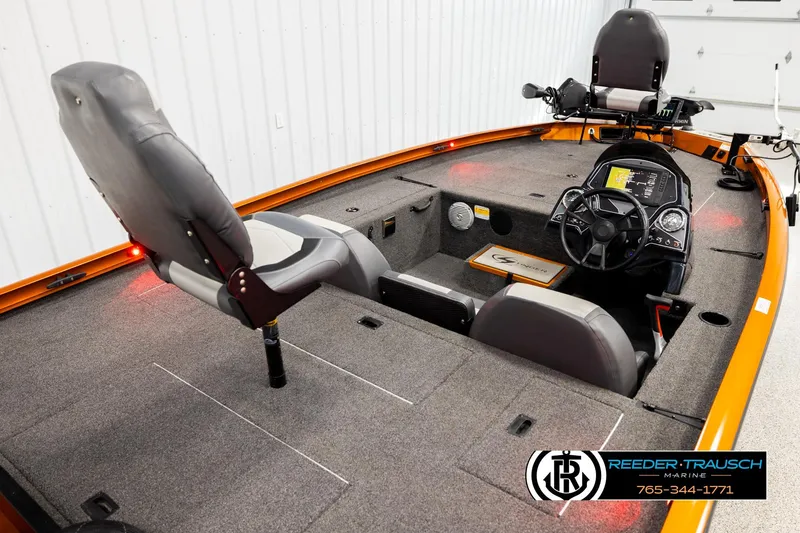 Slide: The Image of 2022 Lowe Stinger 178 boat interior with seating and control panel. - 10