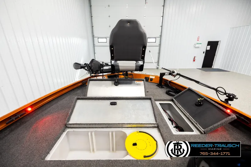 Slide: The Image of 2022 Lowe Stinger 178 boat interior with storage compartments and fishing seat. - 15