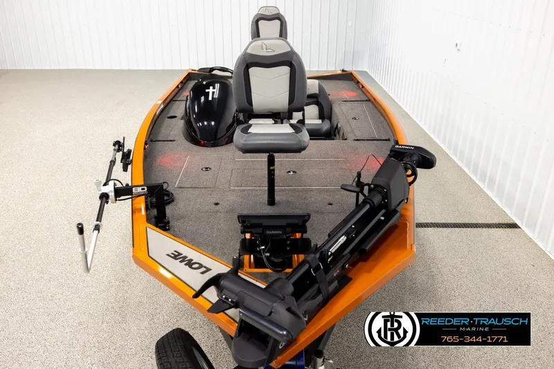 Slide: The Image of 2022 Lowe Stinger 178 boat with fishing seats and trolling motor in showroom. - 16