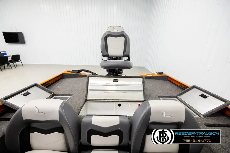 Slide: The Image of 2022 Lowe Stinger 178 boat interior with seating and storage compartments. - 19