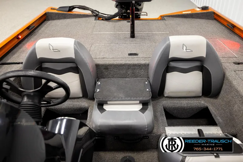 Slide: The Image of 2022 Lowe Stinger 178 boat interior with dual seats and steering wheel. - 21