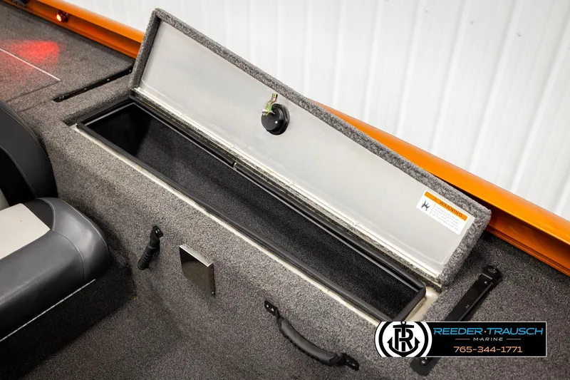 Slide: The Image of 2022 Lowe Stinger 178 boat storage compartment with open lid, showcasing interior space. - 23