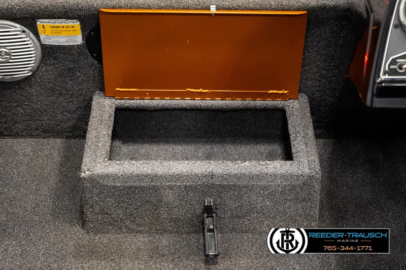 Slide: The Image of 2022 Lowe Stinger 178 boat interior storage compartment with open lid. - 25