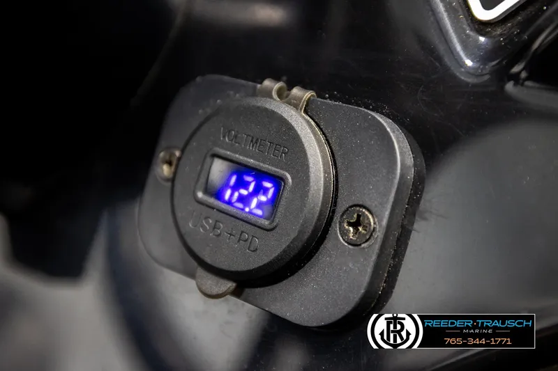 Slide: The Image of Voltmeter with USB port on 2022 Lowe Stinger 178 boat dashboard. - 33