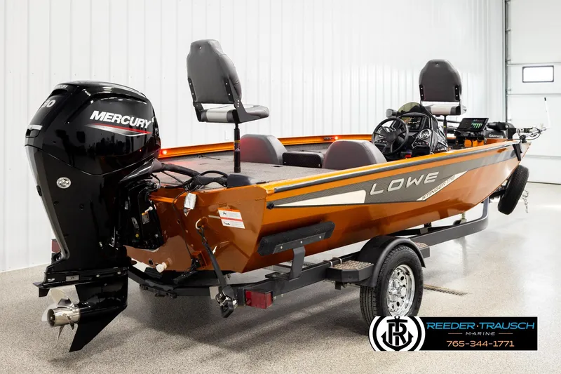 Slide: The Image of 2022 Lowe Stinger 178 boat with Mercury engine on trailer in showroom. - 4