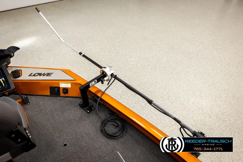 Slide: The Image of 2022 Lowe Stinger 178 boat interior with fishing rod holder and control panel. - 44