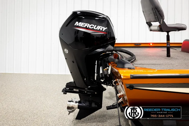 Slide: The Image of 2022 Lowe Stinger 178 boat with Mercury outboard motor, showcased indoors. - 46