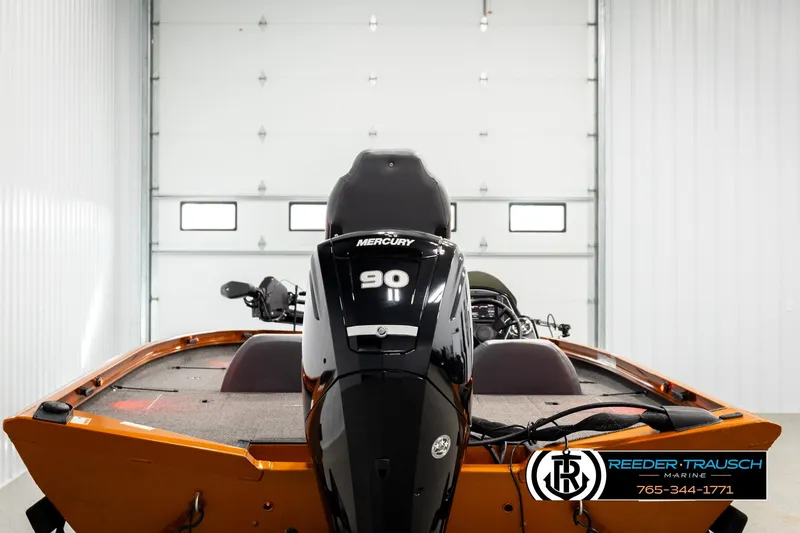 Slide: The Image of 2022 Lowe Stinger 178 boat with Mercury 90 engine in a garage setting. - 5