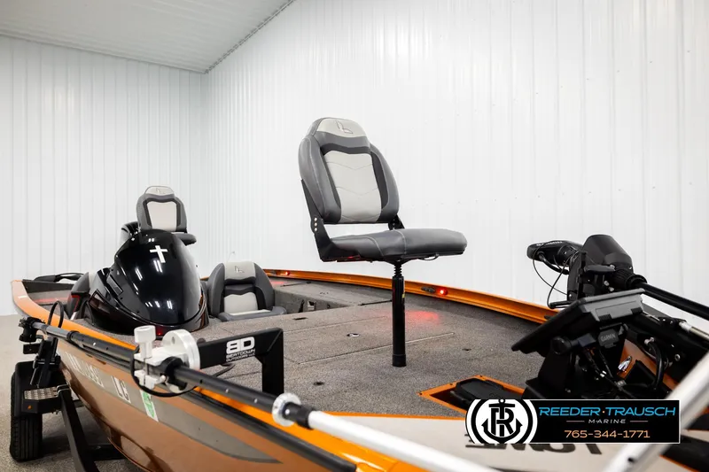 Slide: The Image of 2022 Lowe Stinger 178 boat with seating and motor in a showroom. - 50