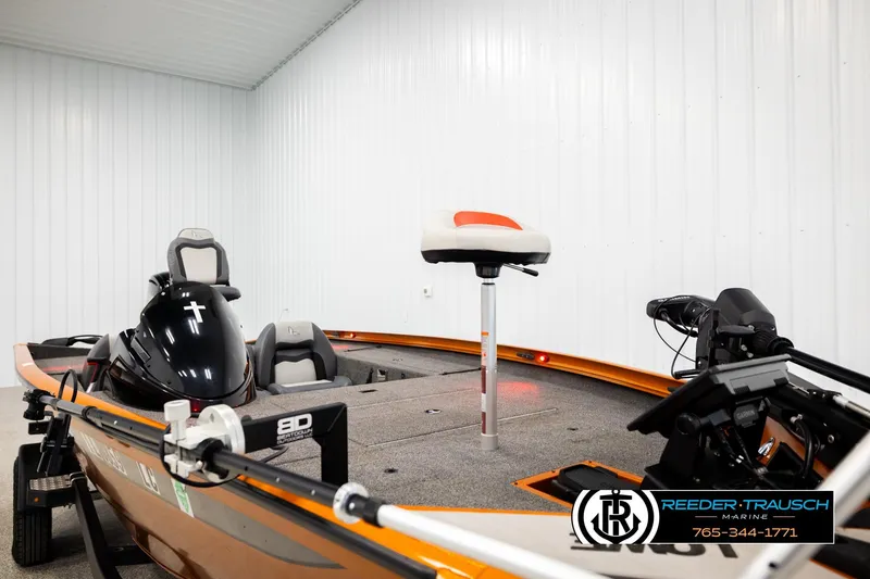 Slide: The Image of 2022 Lowe Stinger 178 boat in showroom, featuring seating and fishing equipment. - 51