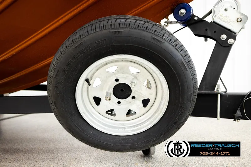 Slide: The Image of Trailer wheel of 2022 Lowe Stinger 178 boat, featuring Reeder-Trausch Marine branding. - 53