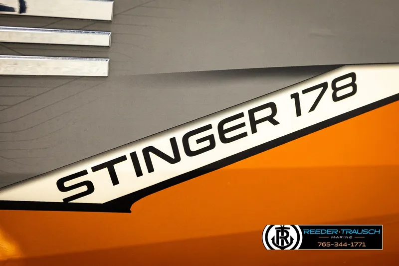 Slide: The Image of 2022 Lowe Stinger 178 boat logo on orange and gray background. - 58