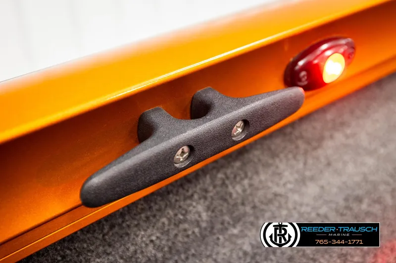 Slide: The Image of 2022 Lowe Stinger 178 boat cleat and light detail, orange finish, Reeder-Trausch Marine logo. - 59