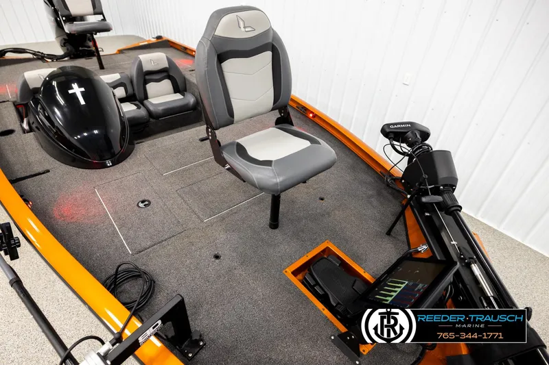 Slide: The Image of 2022 Lowe Stinger 178 boat interior with seating and Garmin equipment. - 7