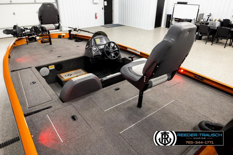 Slide: The Image of 2022 Lowe Stinger 178 boat interior with steering console and seating. - 9