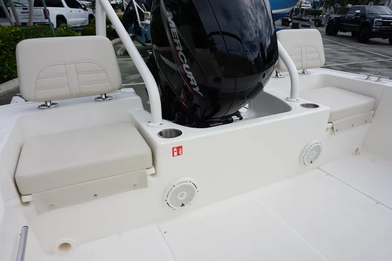 Slide: The Image of 2026 Boston Whaler 190 Montauk boat interior with seating and Mercury engine. - 10