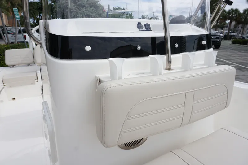 Slide: The Image of 2026 Boston Whaler 190 Montauk boat interior with white seating and console. - 13