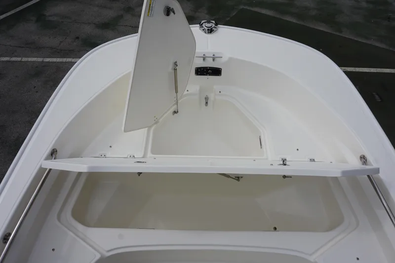 Slide: The Image of 2026 Boston Whaler 190 Montauk boat storage compartment, open and empty. - 16
