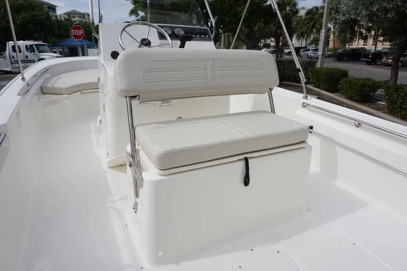 Slide: The Image of 2026 Boston Whaler 190 Montauk boat interior with seating and steering wheel. - 21