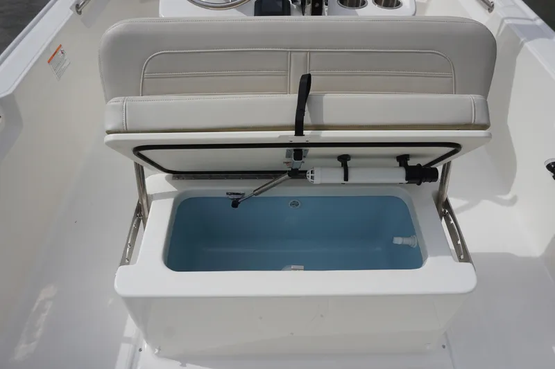 Slide: The Image of 2026 Boston Whaler 190 Montauk boat seat with open storage compartment. - 22