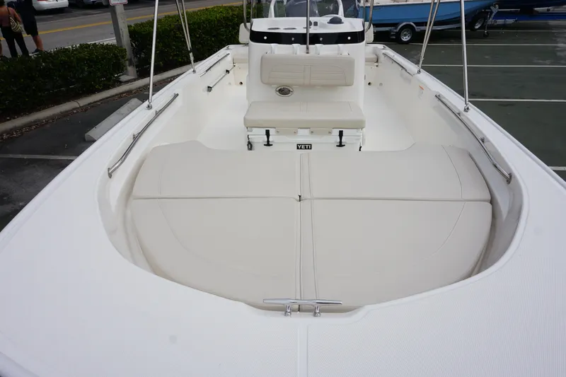 Slide: The Image of 2026 Boston Whaler 190 Montauk boat interior with cushioned seating and Yeti cooler. - 4