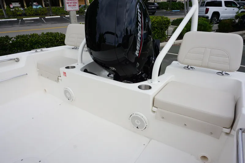 Slide: The Image of 2026 Boston Whaler 190 Montauk boat interior with Mercury engine and seating. - 9