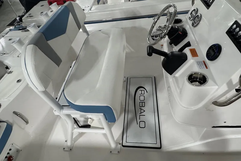 Slide: The Image of 2026 Robalo 206 Cayman boat interior with steering wheel and seating. - 5