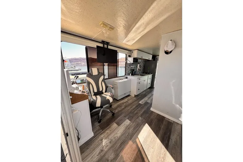 Slide: The Image of Interior of 1984 Boatel Hercules with modern furnishings and lake view. - 21