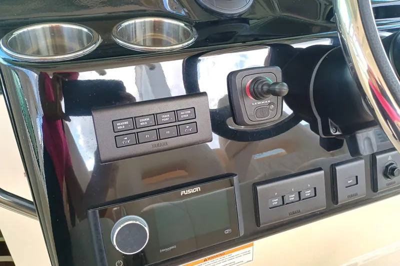 Slide: The Image of Control panel of 2025 Grady-White Canyon 386 boat with Yamaha and Lewmar systems. - 12