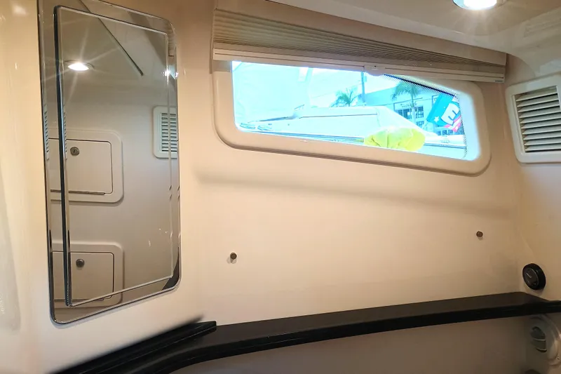 Slide: The Image of Interior of 2025 Grady-White Canyon 386 boat with window and mirror. - 16