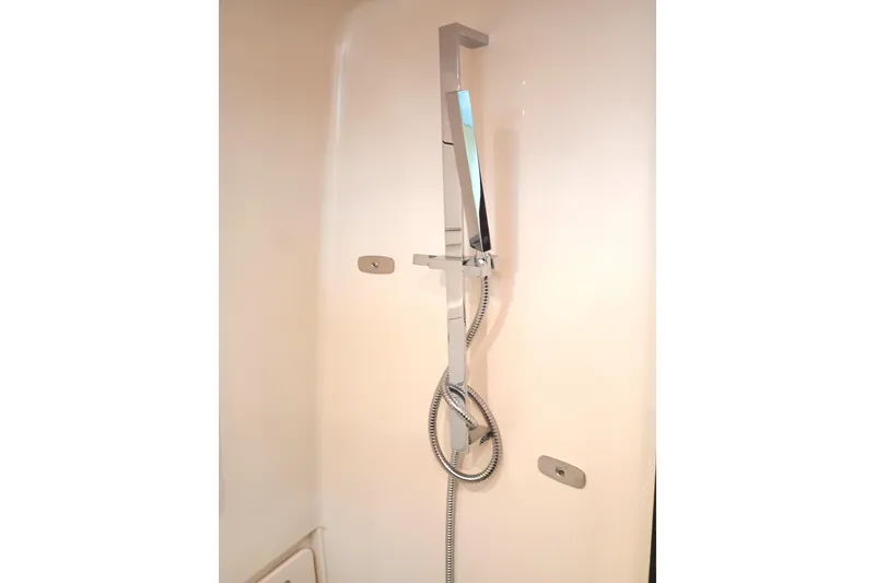 Slide: The Image of Shower area in 2025 Grady-White Canyon 386 boat, featuring modern fixtures. - 18