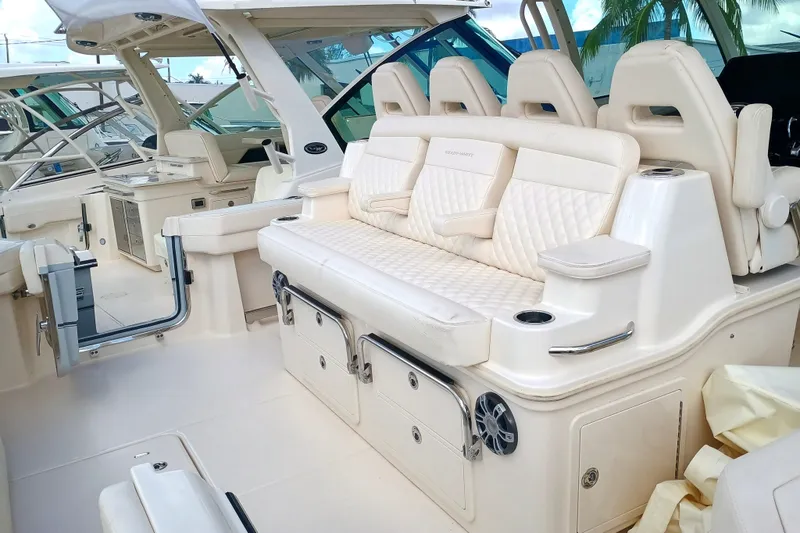 Slide: The Image of 2025 Grady-White Canyon 386 boat interior with luxurious seating and storage compartments. - 24