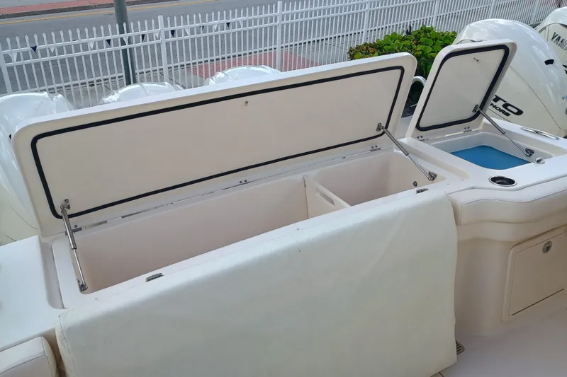 Slide: The Image of 2025 Grady-White Canyon 386 boat storage compartments and Yamaha outboard engines. - 26